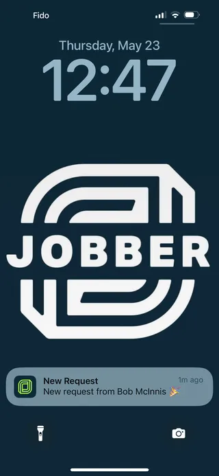 Jobber push notification showing on an iPhone's lock screen