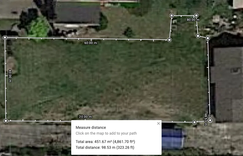 satellite image from Google Maps showing a lawn with measurements around it