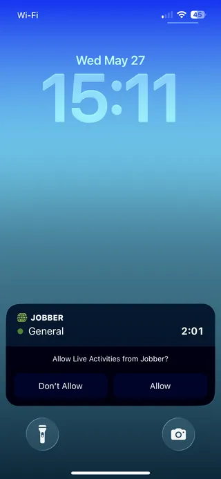 A screenshot showing a live activities box on the lock screen in iOS, including the request to allow it to appear. 
